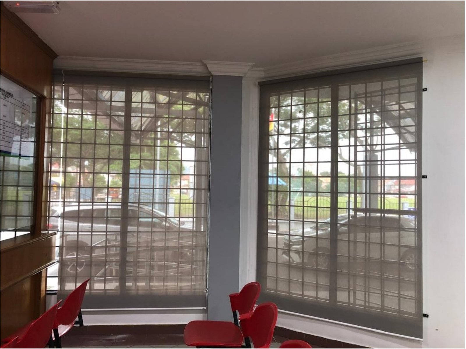 Bay-window roller blinds with grilled windows in a Subang Jaya office
